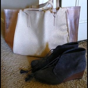 A cute dark brown pair of boot shoes with tassels